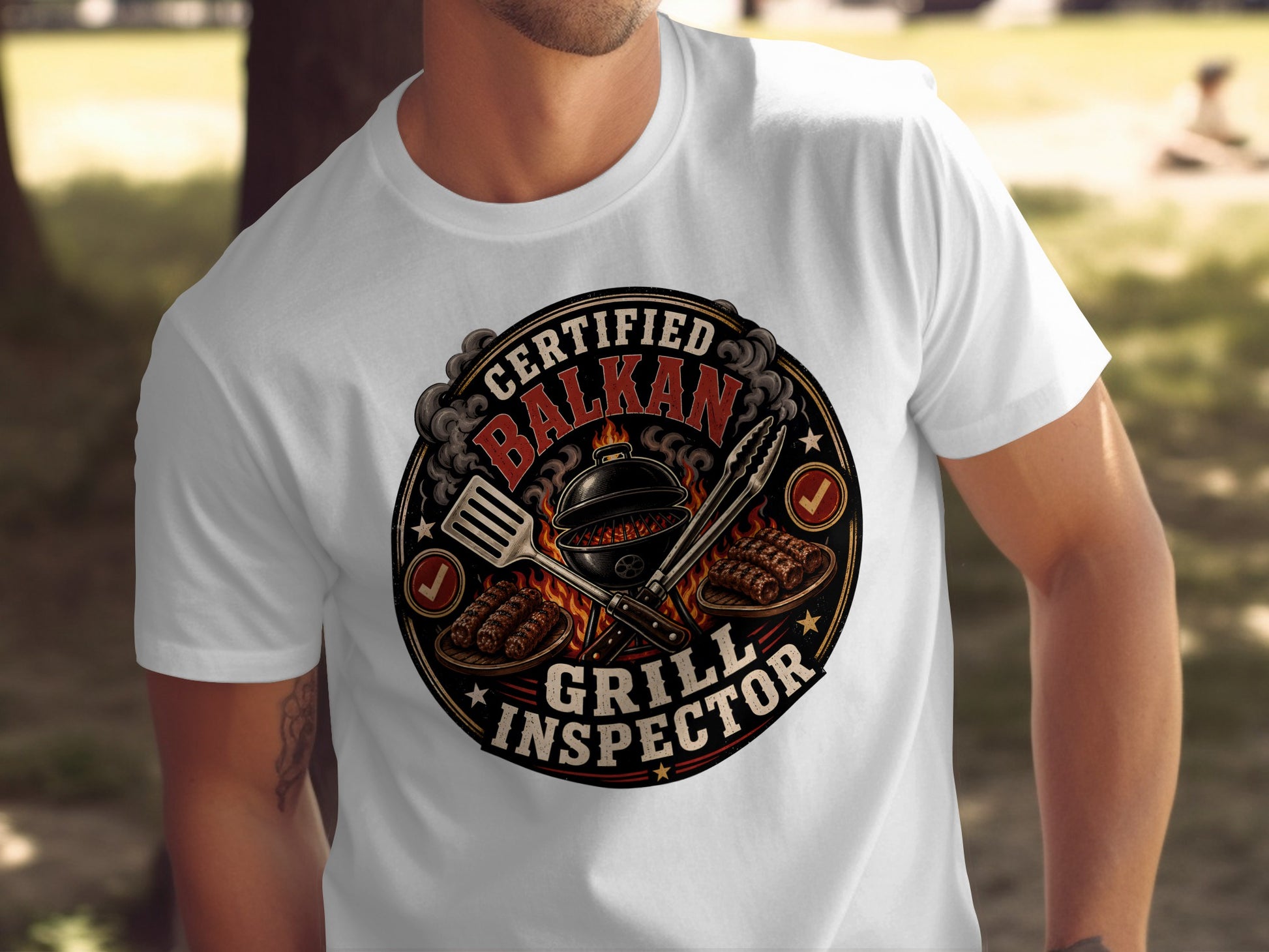 Certified Balkan Grill Inspector text on a t-shirt with grill and skewers.