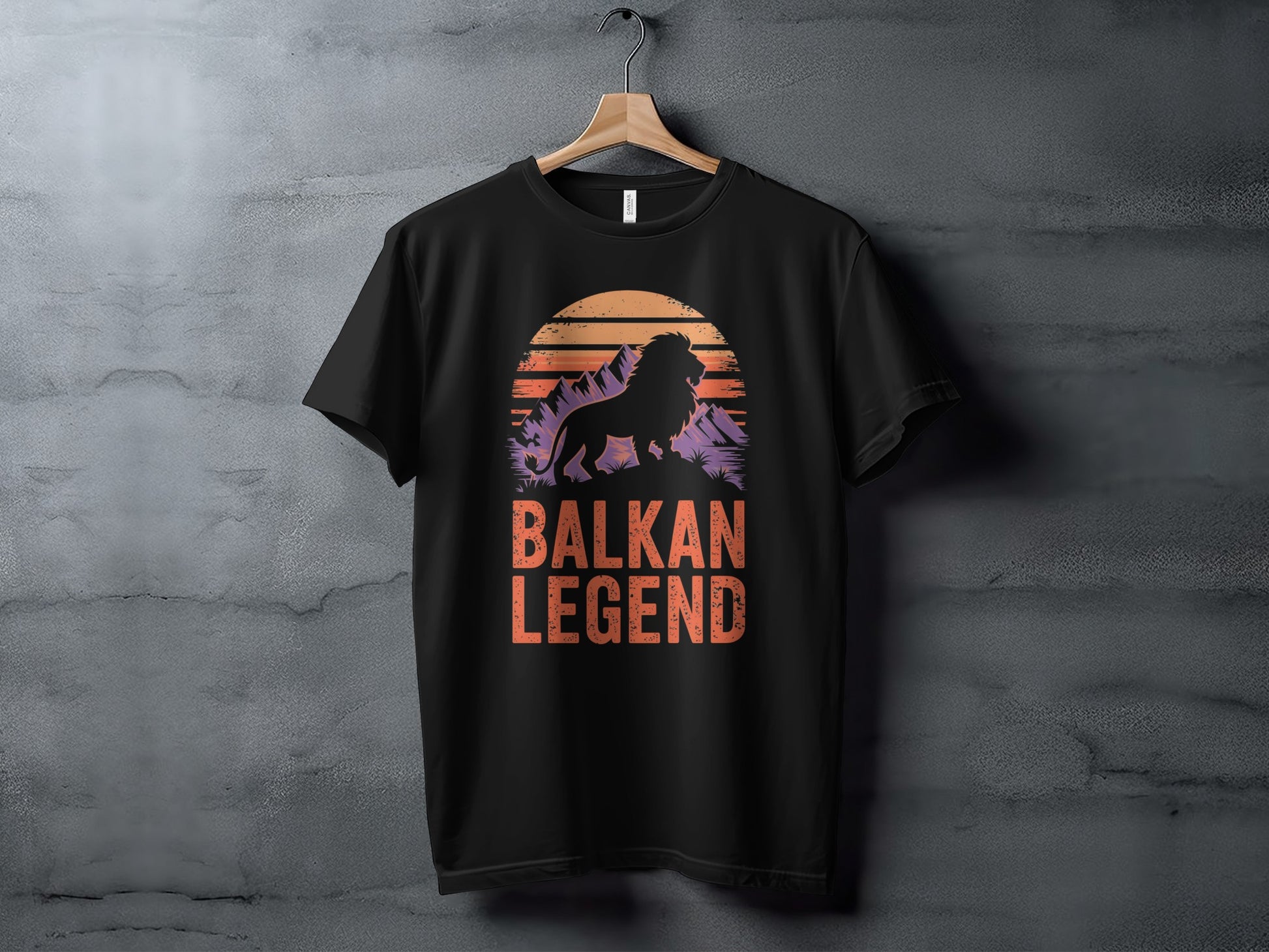 Black t-shirt with "Balkan Legend" text and a lion silhouette against a sunset.
