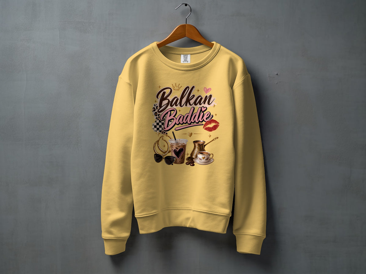 Yellow sweatshirt with "Balkan Baddie" text and coffee and jewelry graphics.