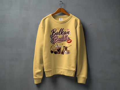 Yellow sweatshirt with "Balkan Baddie" text and coffee and jewelry graphics.