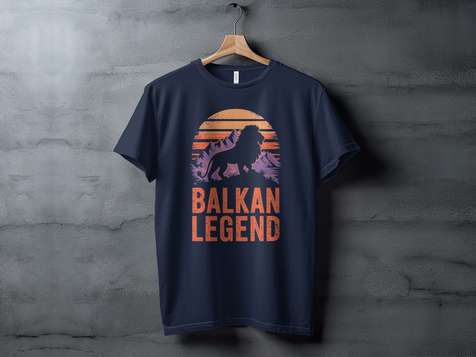 Dark blue t-shirt with "BALKAN LEGEND" text and a lion silhouette against a sunset.