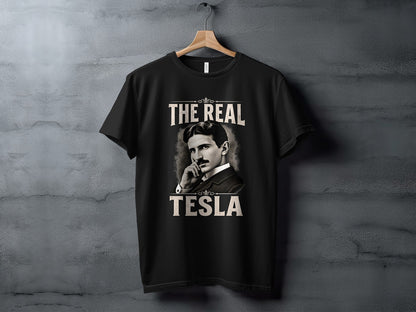 Black t-shirt with "The Real Tesla" text and portrait of Nikola Tesla.