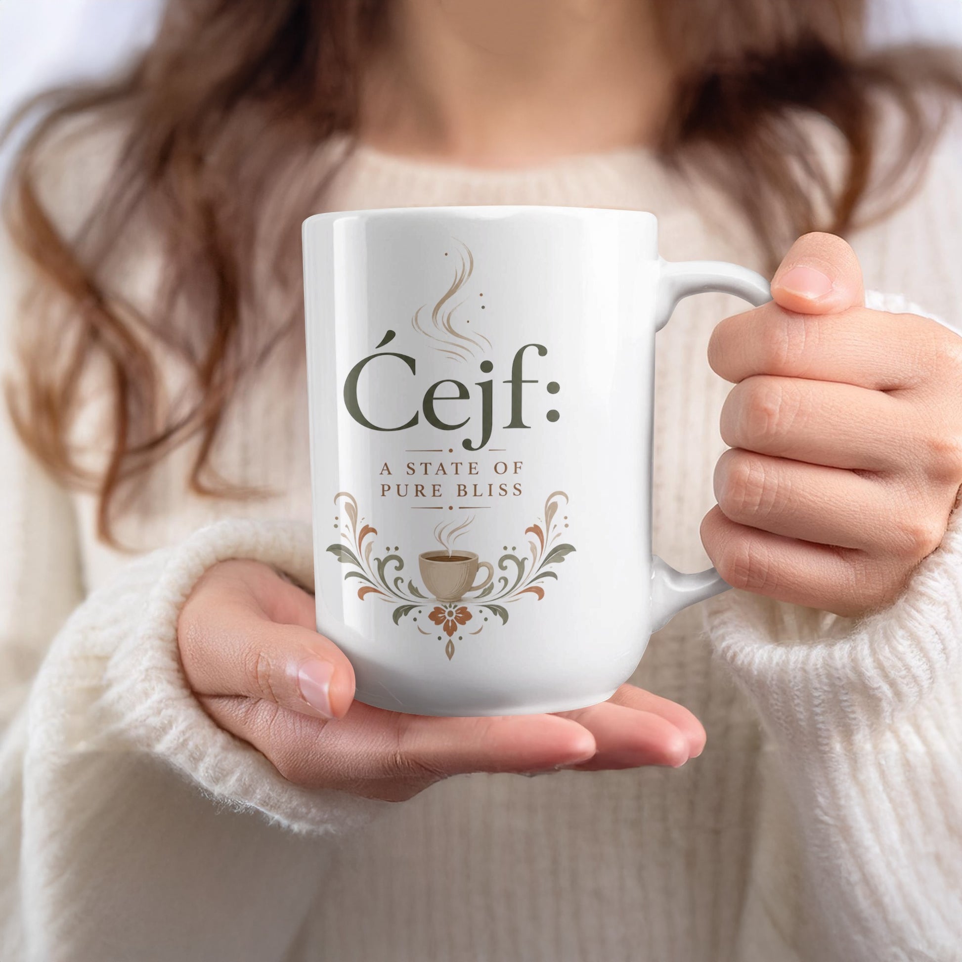 White mug with "Ćejf: a state of pure bliss" text and coffee cup design.