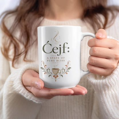 White mug with "Ćejf: a state of pure bliss" text and coffee cup design.