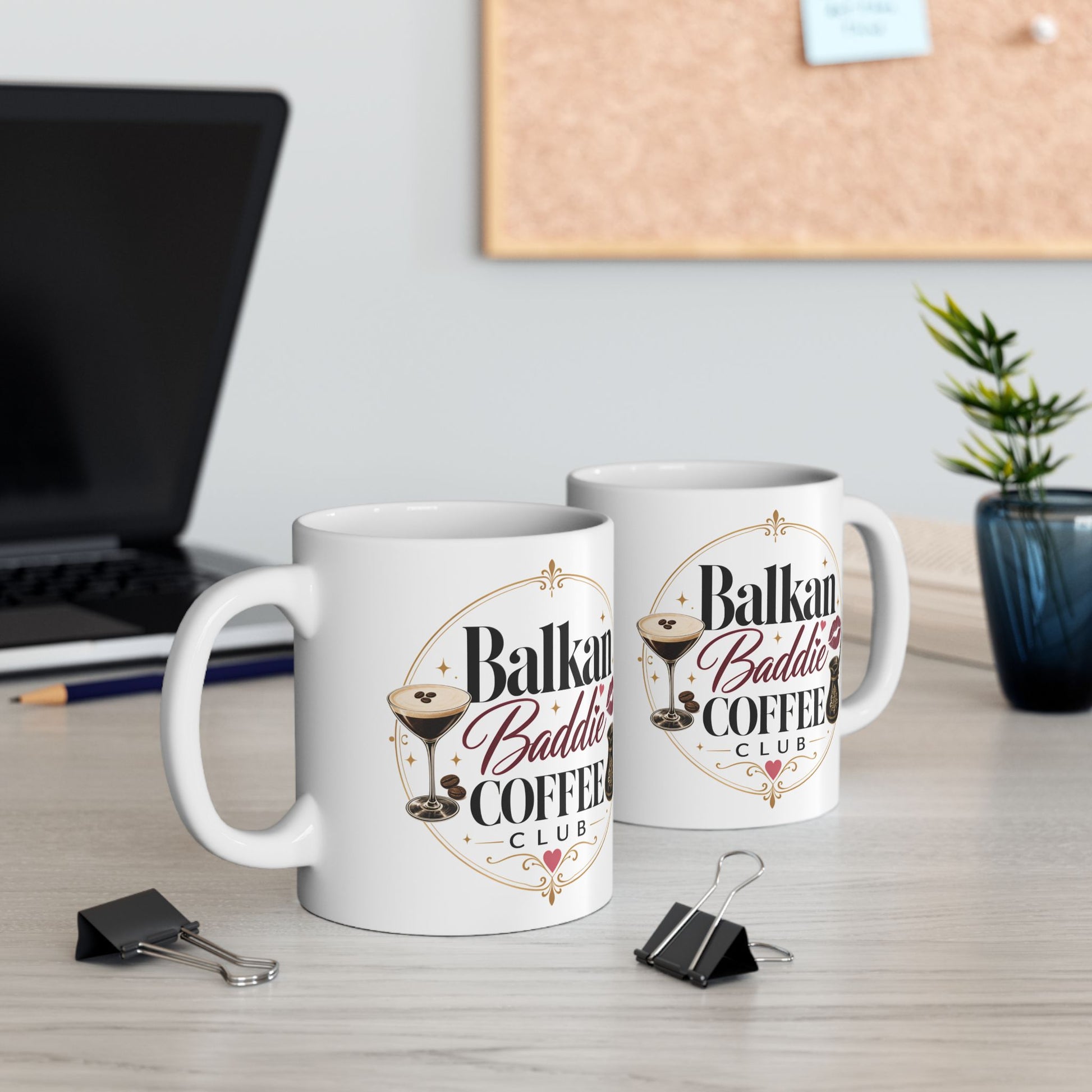 Two white mugs with "Balkan Baddie Coffee Club" text and cocktail graphics.