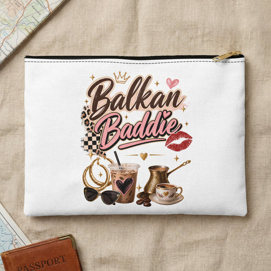 White pouch with "Balkan Baddie" text, coffee, sunglasses, and jewelry.