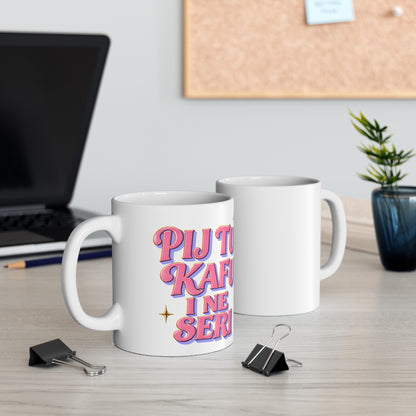 White mug with pink text saying "PIJ TU KAFU I NE SERI".