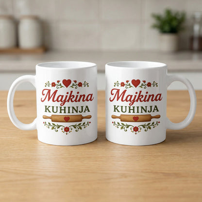 Two white mugs with "Majkina Kuhinja" in red and green text with rolling pin graphic.