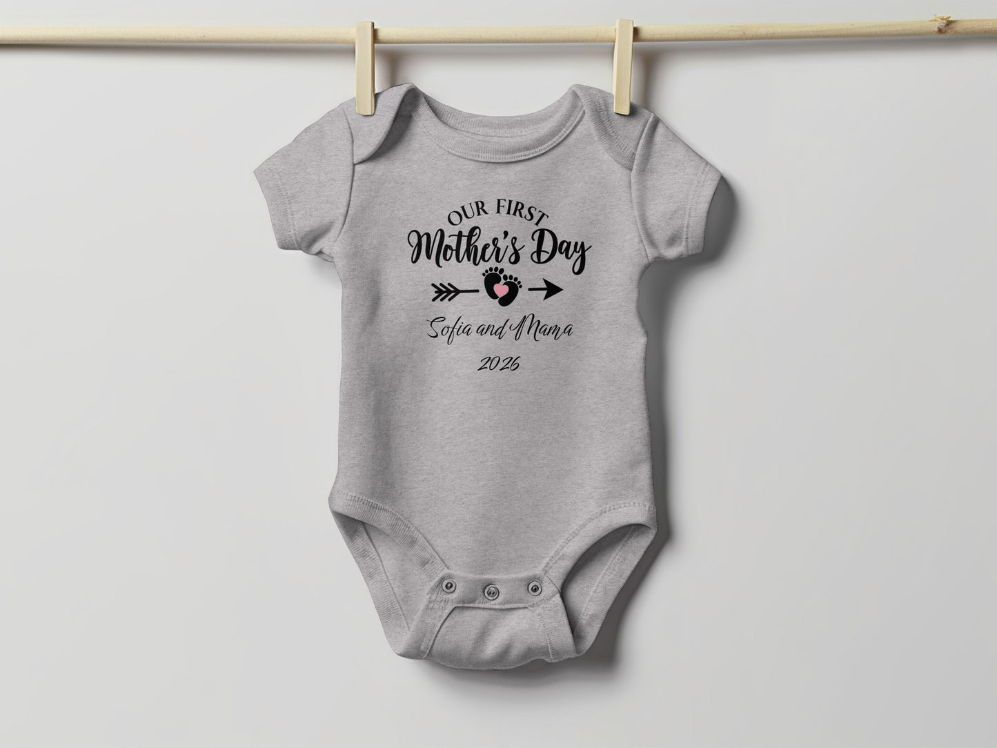 Gray baby onesie with "Our First Mother's Day Sofia and Mama 2025" text.
