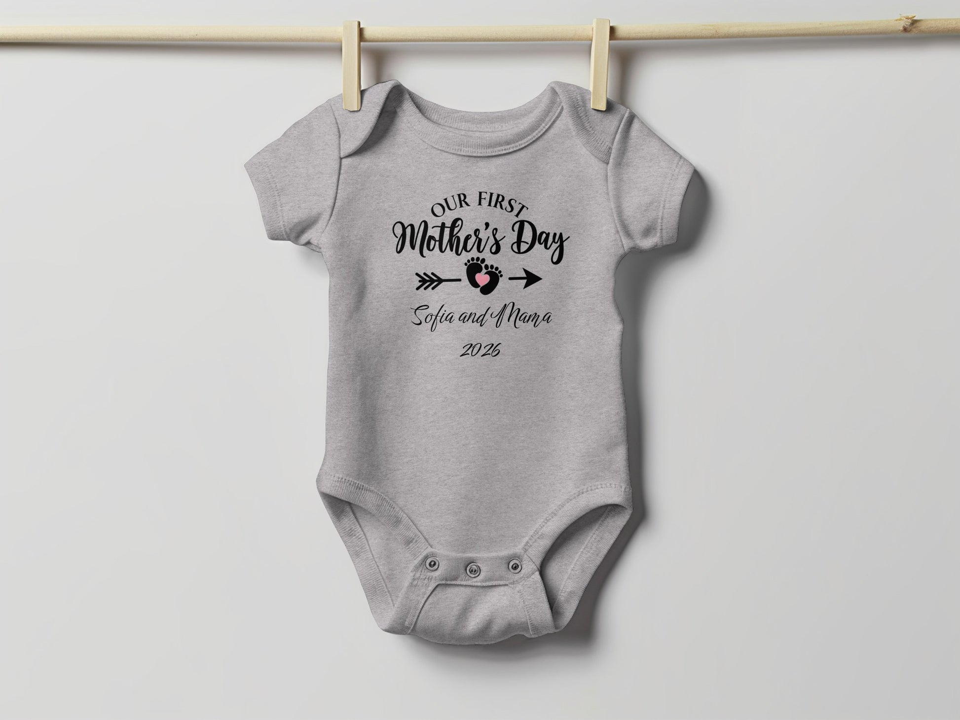 Gray baby onesie with "Our First Mother's Day Sofia and Mama 2025" text.