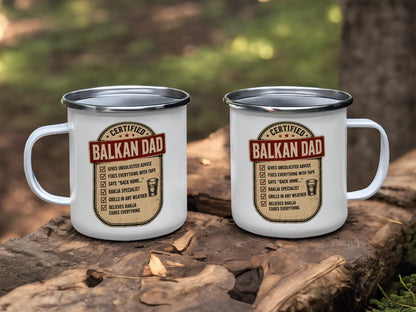 Two enameled mugs with "Certified Balkan Dad" and humorous text.