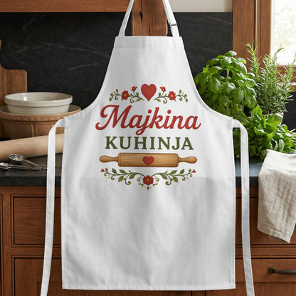 White apron with "Majkina KUHINJA" text, heart, rolling pin, and floral design.