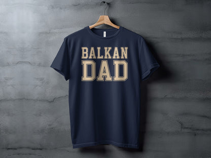 Navy t-shirt with "BALKAN DAD" in beige collegiate-style lettering.