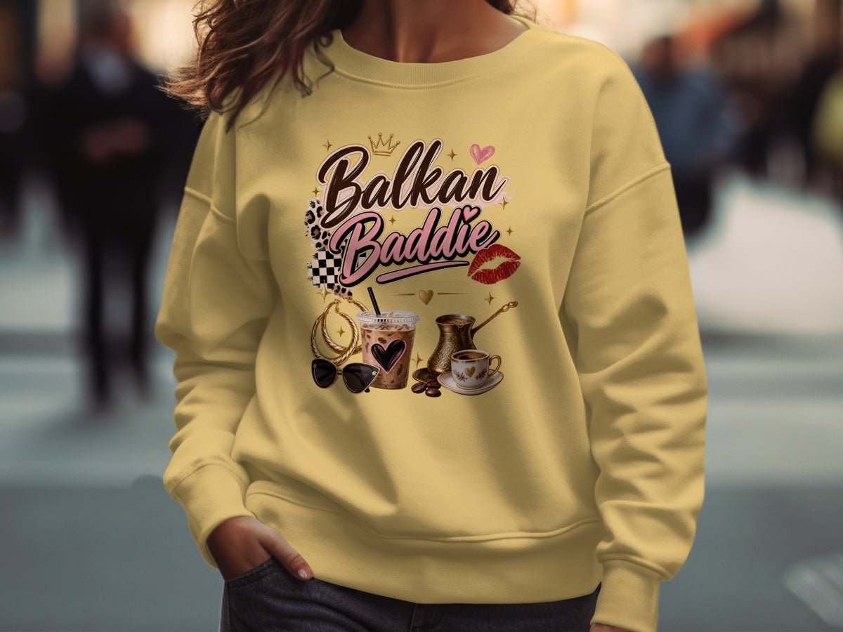 Yellow sweatshirt with "Balkan Baddie" text, iced coffee, coffee pot, and sunglasses.