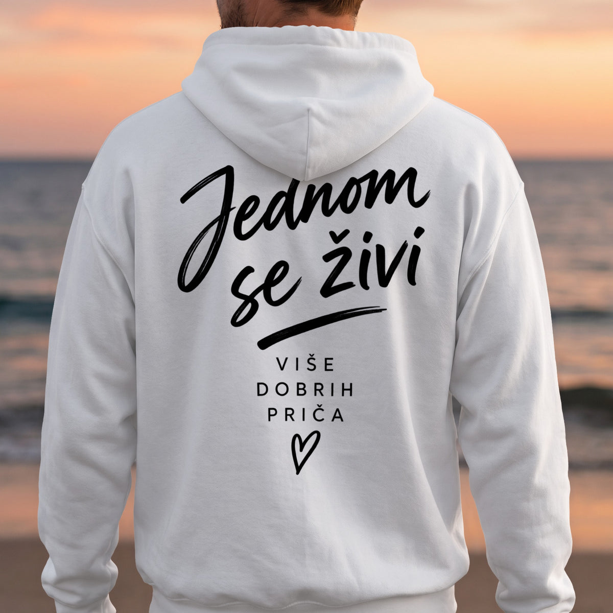 White hoodie with black text: "Jednom se živi" and "VIŠE DOBRIH PRIČA".
