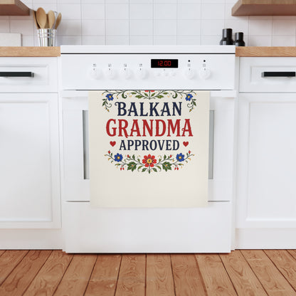 Tea towel with "Balkan Grandma Approved" in red and blue floral border.