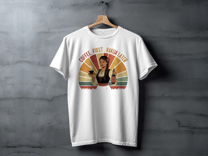 White t-shirt with woman holding coffee and a bottle of Rakia, text "Coffee. First. Rakia. Later."