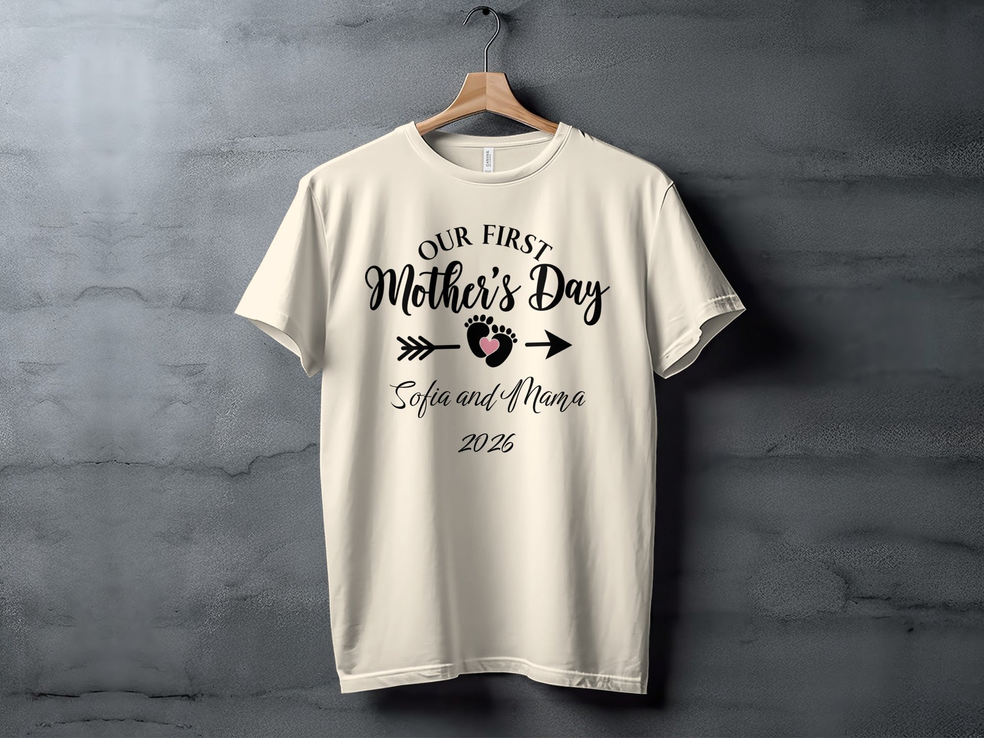 Cream t-shirt with "Our First Mother's Day", heart arrow, "Sofia and Mama", and "2026".