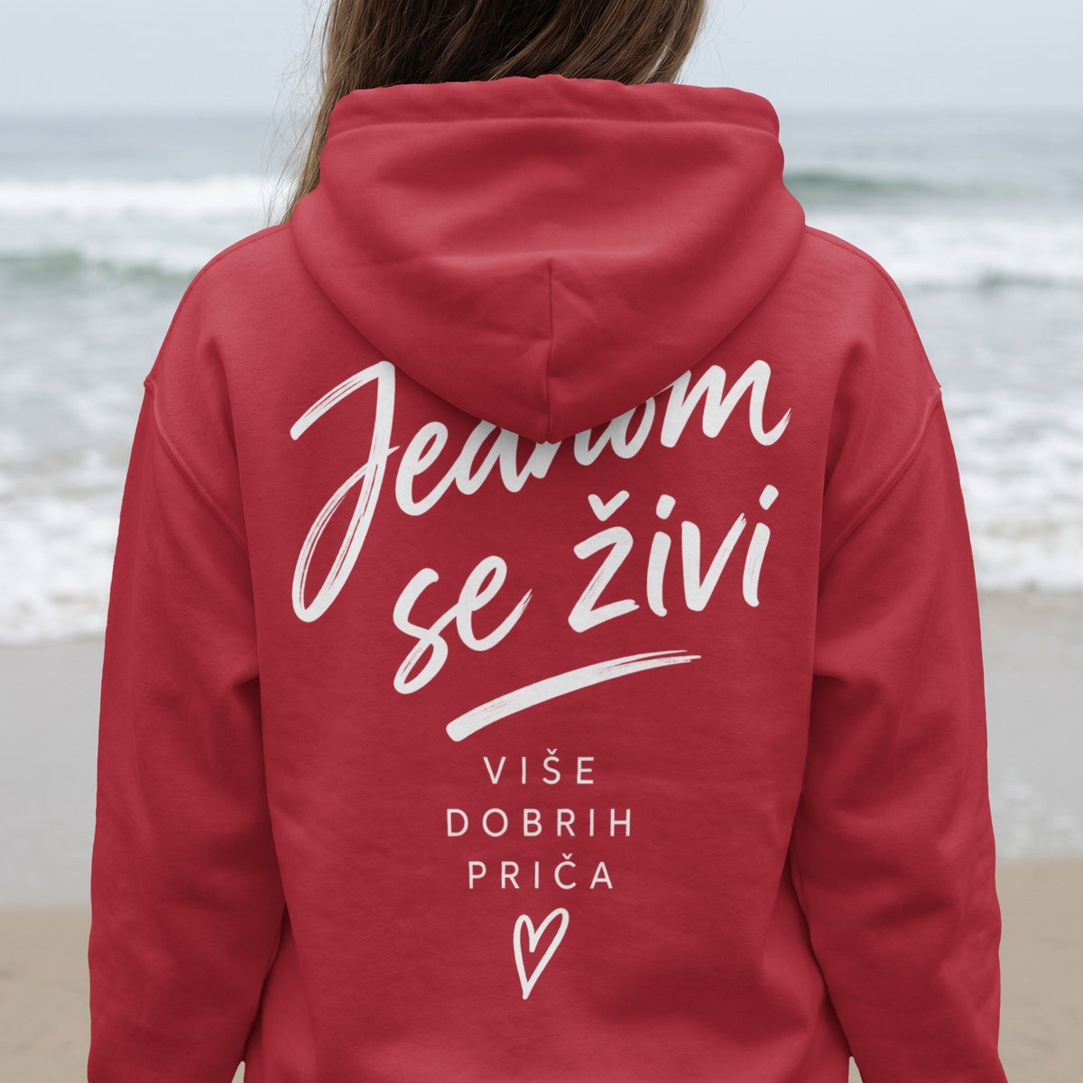 Red hoodie with white text: "Ježom se živi, Više dobrih priča" and a heart.