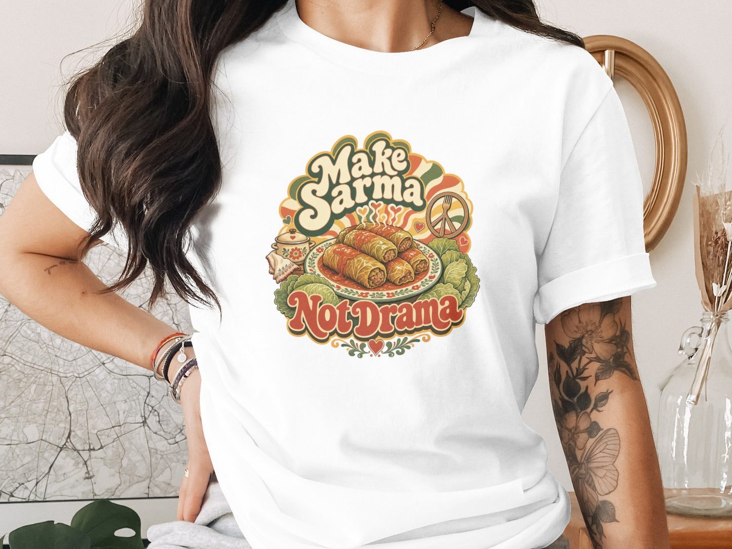 T-shirt with "Make Sarma Not Drama" text and illustration of stuffed cabbage rolls.