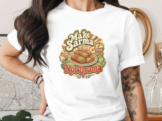 T-shirt with "Make Sarma Not Drama" text and illustration of stuffed cabbage rolls.