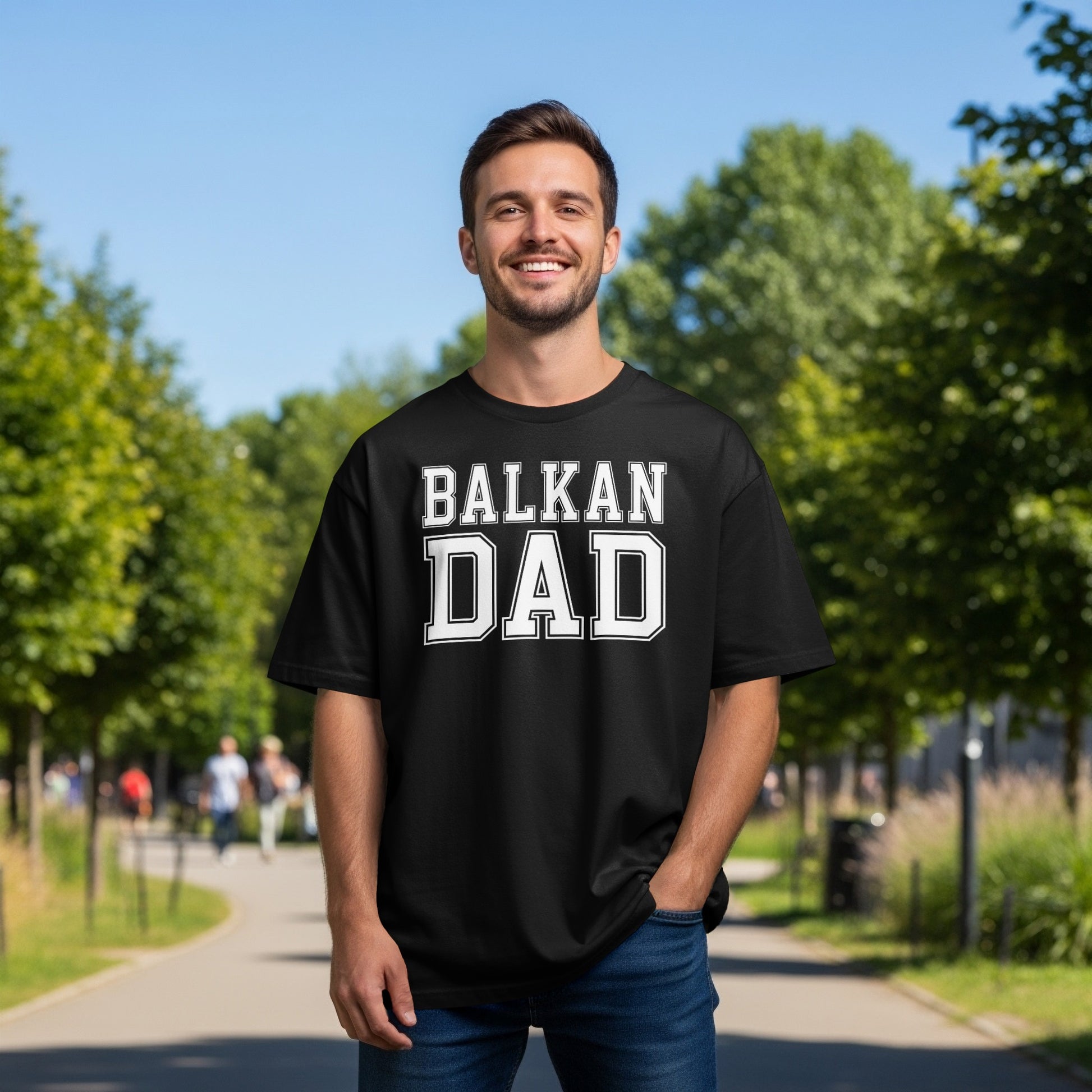 Man wearing black t-shirt with "BALKAN DAD" in white block letters.
