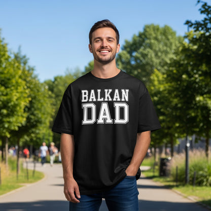 Man wearing black t-shirt with "BALKAN DAD" in white block letters.
