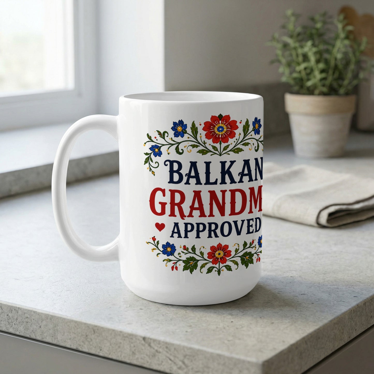 White mug with "Balkan Grandma Approved" and floral border.