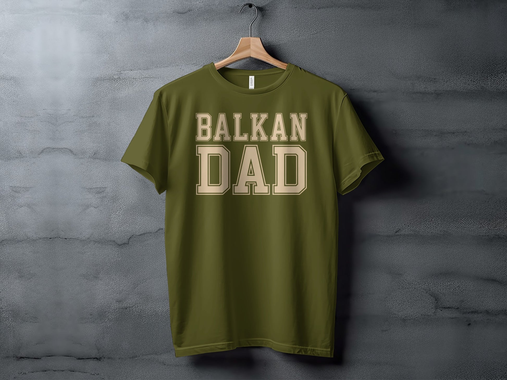 Olive green t-shirt with "BALKAN DAD" in tan block letters.