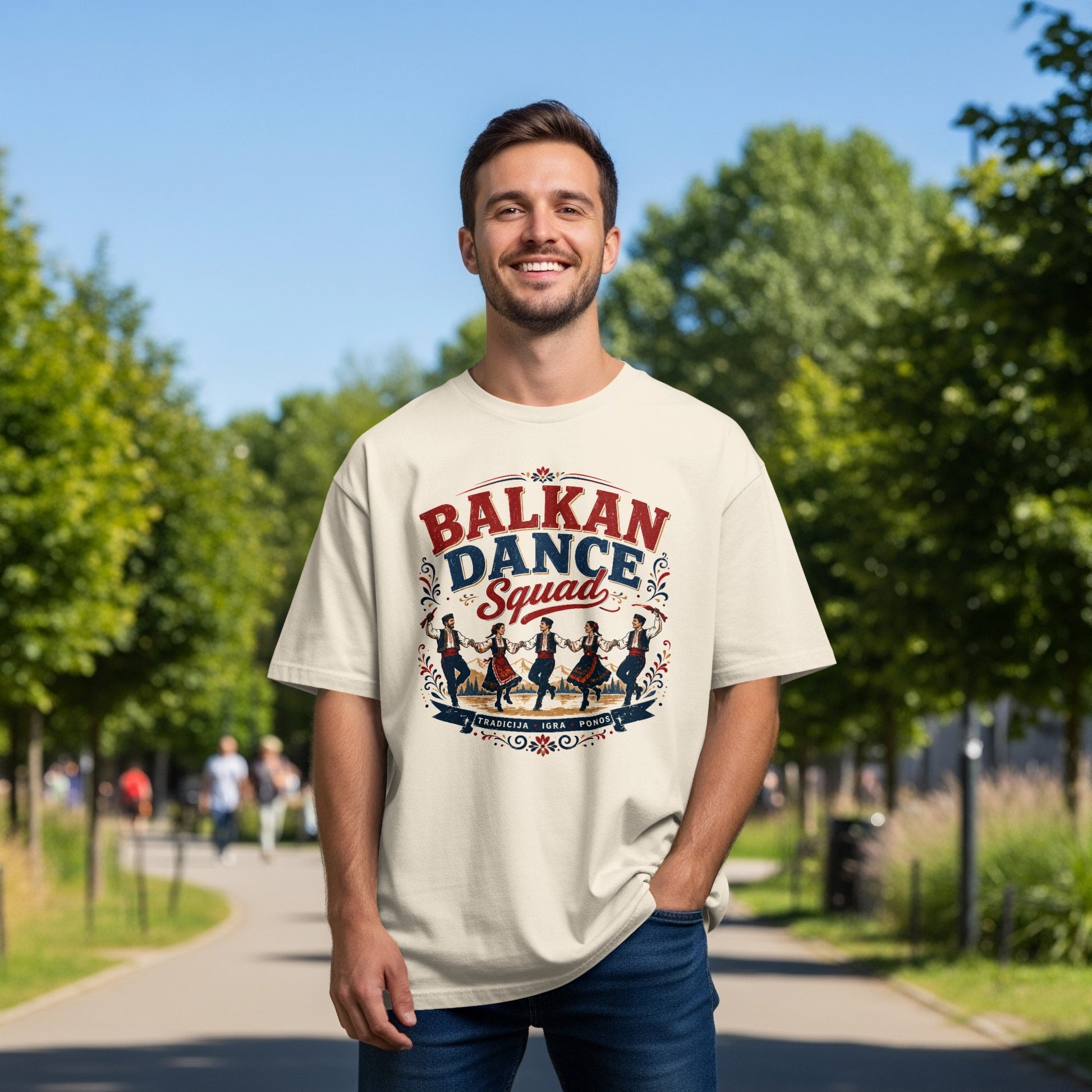 Cream t-shirt with "Balkan Dance Squad" graphic and traditional dancers.