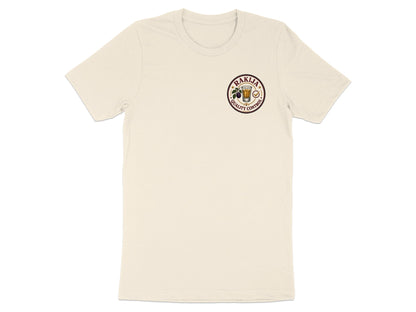 Cream t-shirt with circular "Rakija Quality Control" logo.