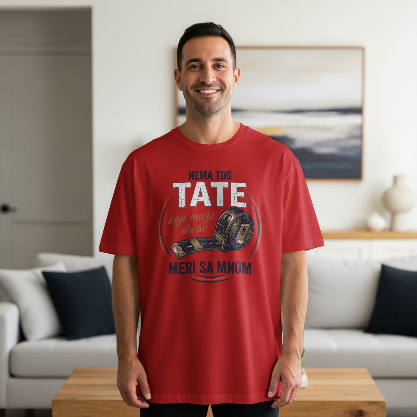 Red t-shirt with "TATE MERI SA MNOM" and measuring tape graphic.