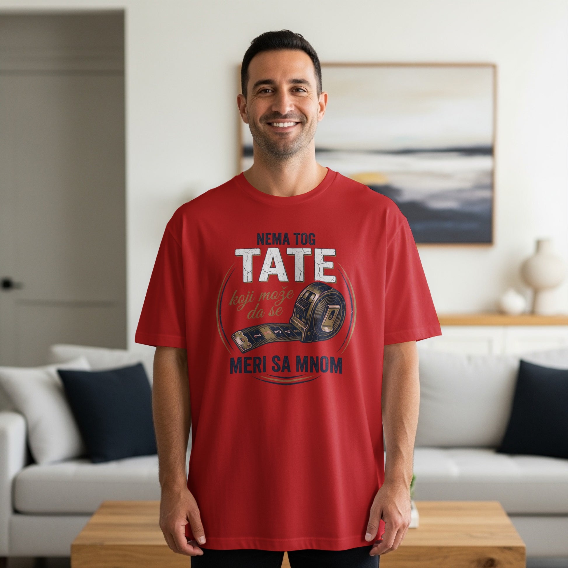 Red t-shirt with "TATE MERI SA MNOM" and measuring tape graphic.
