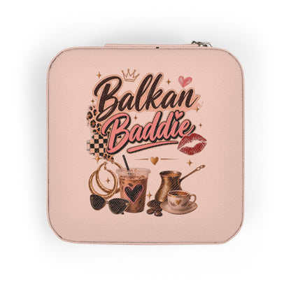 Pink jewelry box with "Balkan Baddie" text, coffee, and accessories.