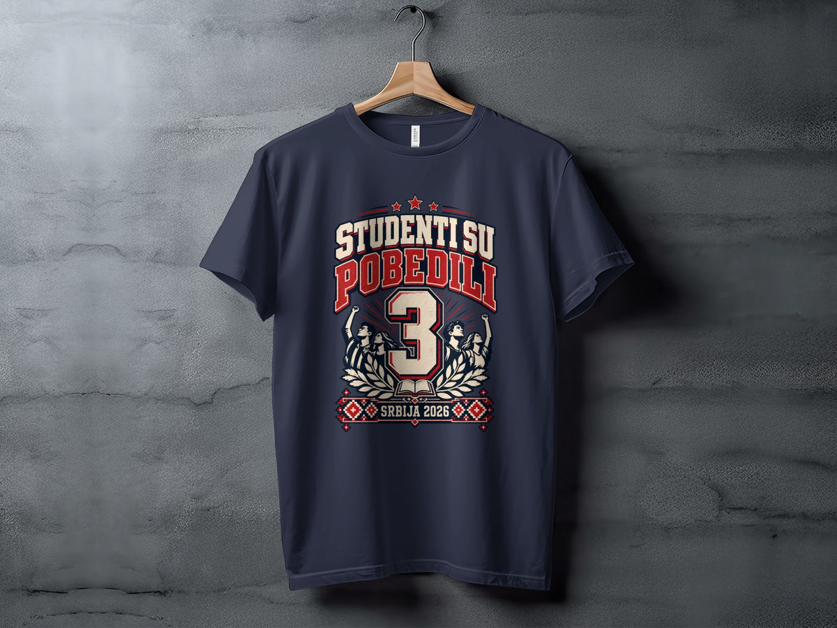 A dark gray t-shirt hanging on a wooden hanger, featuring a red and white graphic with the text "STUDENTI SU POBEDILI" and "SRBIJA 2026."
