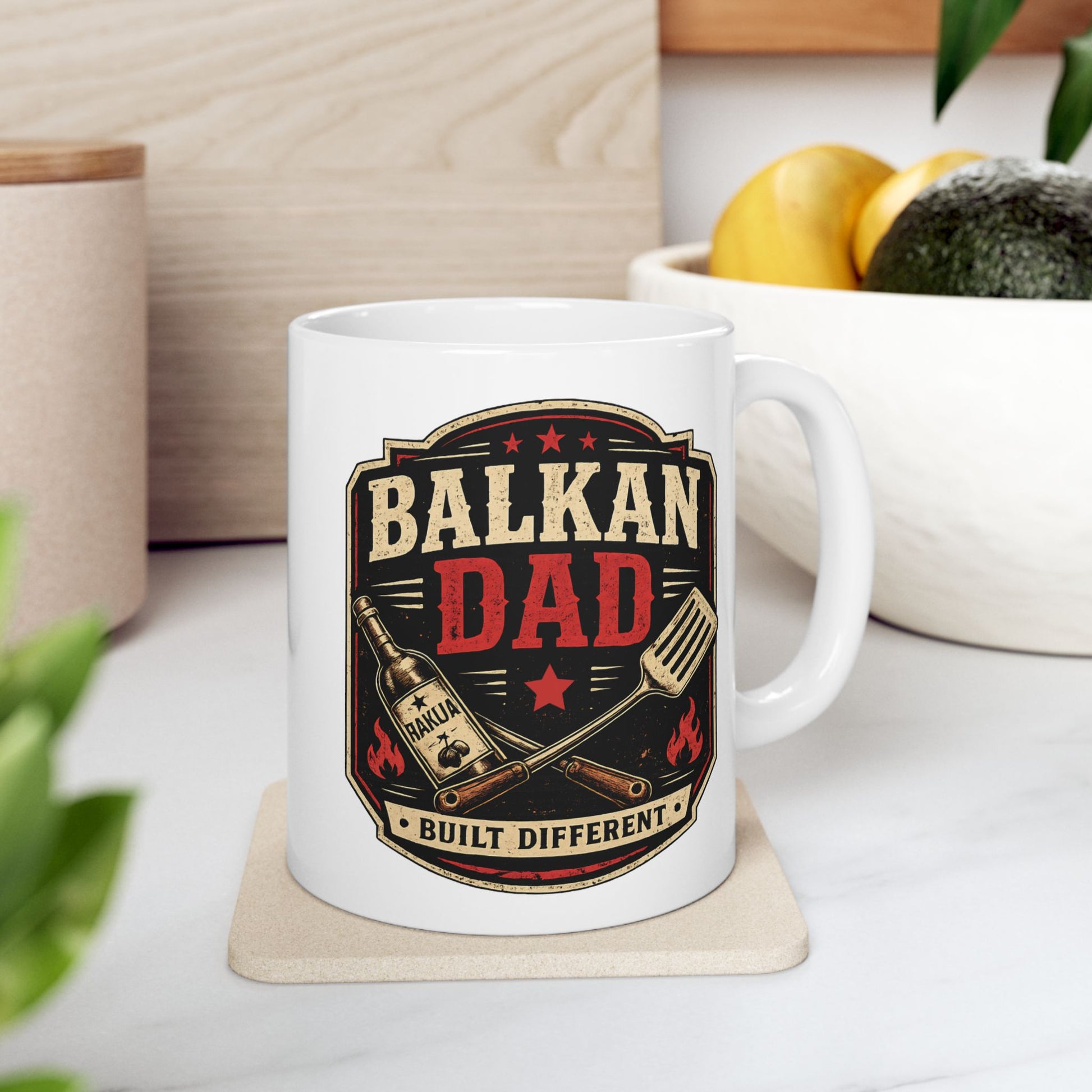 White mug with "Balkan Dad Built Different" text and barbecue tools design.